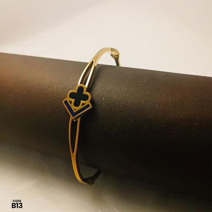 Elegant Gold-Tone Adjustable Open Bangle with Black Enamel Clover & Geometric Design | B13