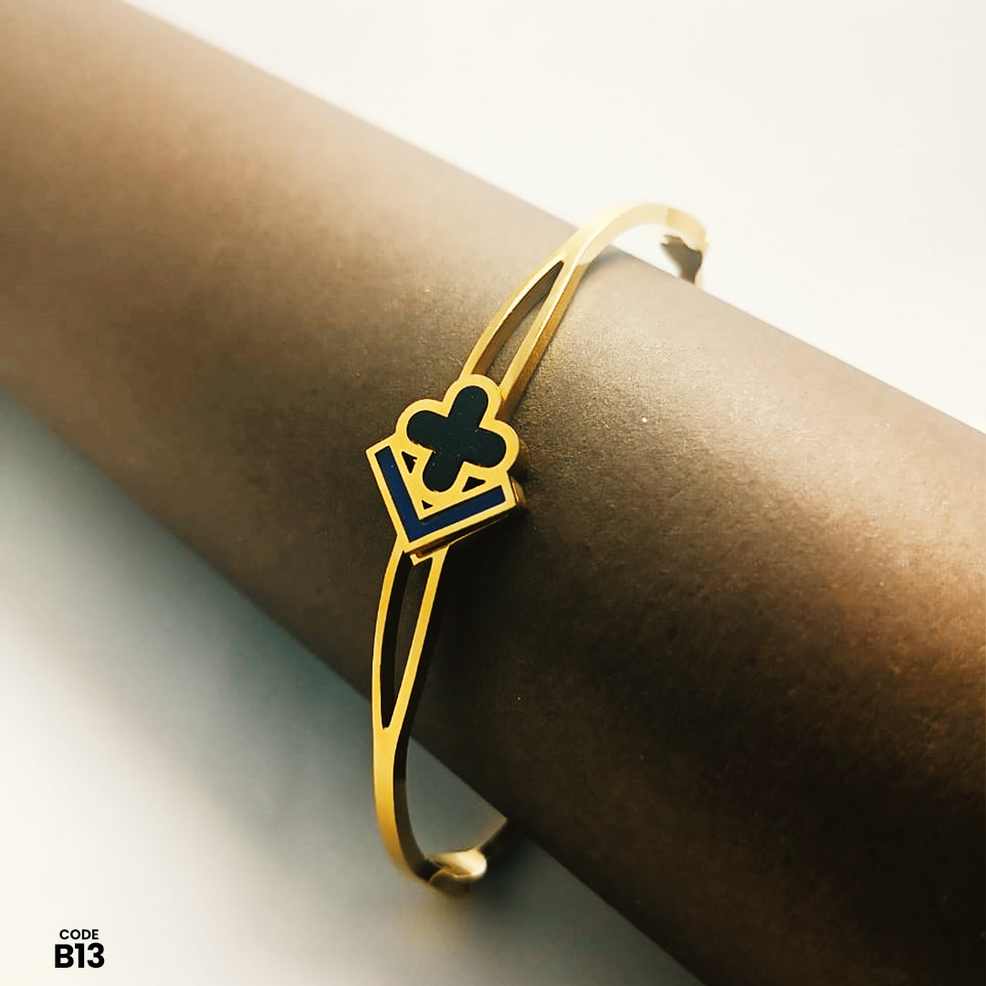 Elegant Gold-Tone Adjustable Open Bangle with Black Enamel Clover & Geometric Design | B13