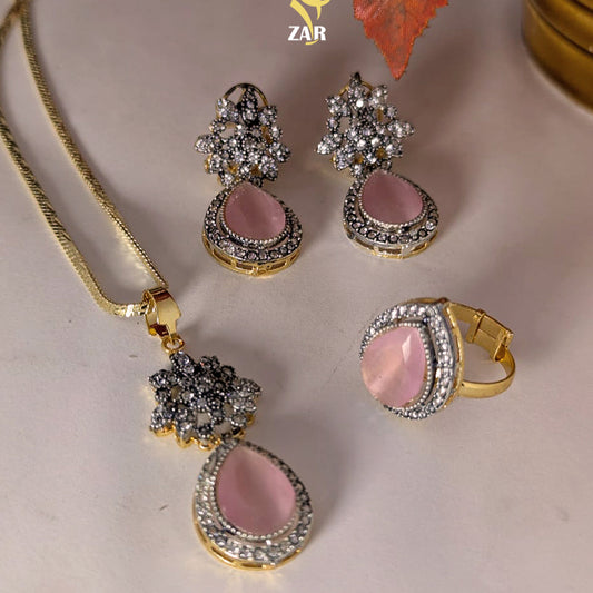 Jewelry set with pink stones and gold accents on a neutral background, featuring the brand 'ZAR'.